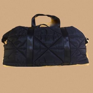 Oversized Nylon quilted Duffle bag. Long, detachable webbed strap.NWT